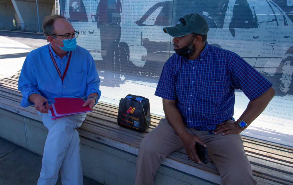 L-R: GBT CEO Doug Holcomb chats with rider Bamidele B.