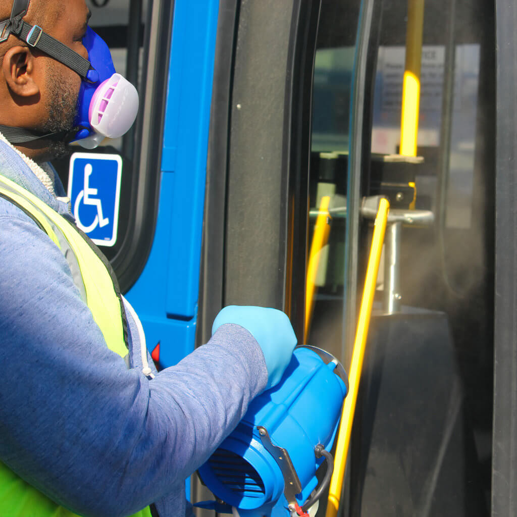 Disinfecting buses.