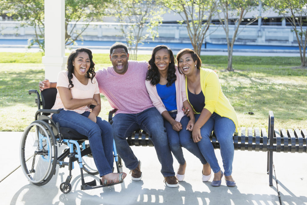 Happy family with person with a disability